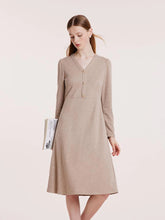 a woman in v-neck jersey dress